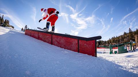 Santa doing a trick on a rail